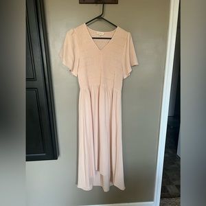 Roolee peach midi dress with tulip sleeve detail.